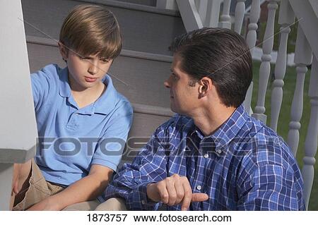 Stock Photo - a father talking to his son. Fotosearch