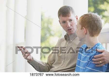 Stock Photo - a father talking with his son. Fotosearch