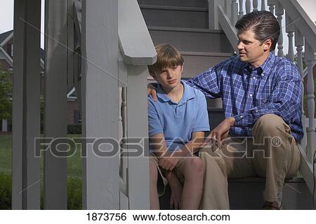 a father talking with his son View Large Photo Image Stock Photograph - a father talking with his son. Fotosearch