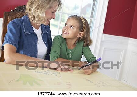 a girl and her mother drawing a picture saying 'i am thankful for my family' View Large Photo Image Picture - a girl and her mother drawing a picture saying 'i am thankful for my family'. Fotosearch