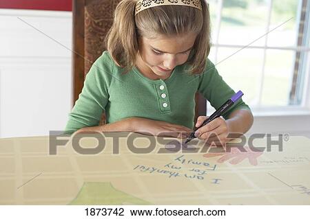 a girl drawing a picture saying 'i am thankful for my family' View Large Photo Image Stock Image - a girl drawing a picture saying 'i am thankful for my family'. Fotosearch