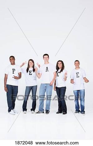 a group of teenagers making the peace sign and wearing t-shirts with the message 'peace' View Large Photo Image Stock Photo - a group of teenagers making the peace sign and wearing t-shirts with the message 'peace'. Fotosearch