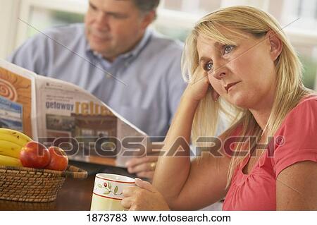 a wife being ignored by a husband reading the newspaper View Large Photo Image Stock Image - a wife being ignored by a husband reading the newspaper. Fotosearch