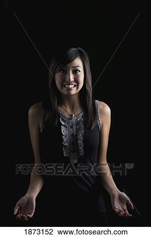 Stock Image - a woman asking a question with body language. Fotosearch