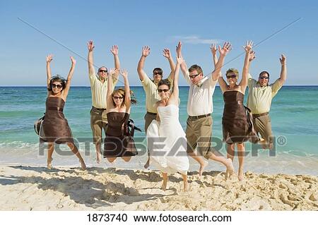 akumal, mexico; a bride and groom on the beach with their wedding party View Large Photo Image Stock Image - akumal, mexico; a bride and groom on the beach with their wedding party. Fotosearch