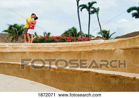 akumal, mexico; a couple kissing by a stone ledge View Large Photo Image Stock Image - akumal, mexico; a couple kissing by a stone ledge. Fotosearch