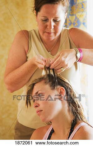 akumal, mexico; a mother braiding her daughter's hair View Large Photo Image Stock Image - akumal, mexico; a mother braiding her daughter's hair. Fotosearch