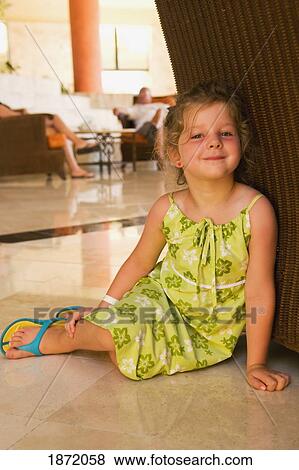 akumal, mexico; a young girl sitting on the floor at a hotel View Large Photo Image Stock Photo - akumal, mexico; a young girl sitting on the floor at a hotel. Fotosearch