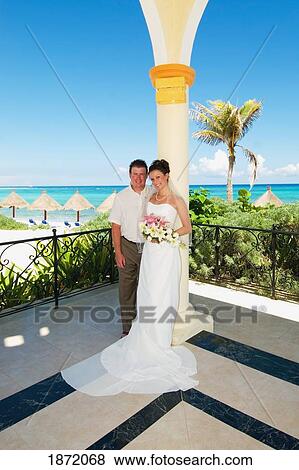 akumal, riviera maya, mexico; a bride and groom in a gazebo by the beach at gran bahia principe tulum all-inclusive resort View Large Photo Image Stock Photo - akumal, riviera maya, mexico; a bride and groom in a gazebo by the beach at gran bahia principe tulum all-inclusive resort. Fotosearch
