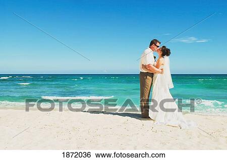 akumal, riviera maya, mexico; a bride and groom kissing on the beach at gran bahia principe tulum all-inclusive resort View Large Photo Image Stock Photograph - akumal, riviera maya, mexico; a bride and groom kissing on the beach at gran bahia principe tulum all-inclusive resort. Fotosearch
