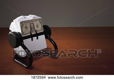 an american dollar bill in a rolodex View Large Photo Image Picture - an american dollar bill in a rolodex. Fotosearch