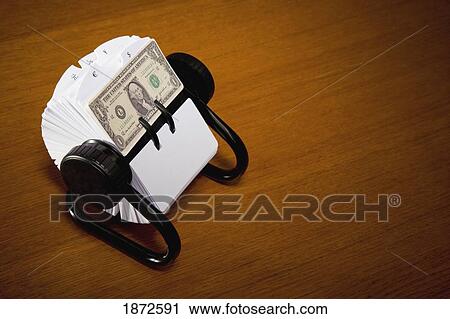 Stock Image - an american dollar bill in a rolodex. Fotosearch