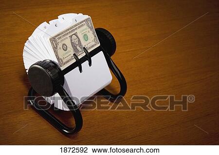 Stock Image - an american dollar bill in a rolodex. Fotosearch