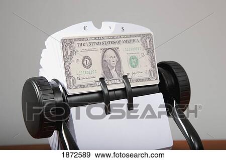 Stock Photo - an american dollar bill in a rolodex. Fotosearch