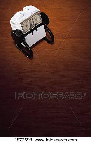 Stock Photo - an american dollar bill in a rolodex. Fotosearch