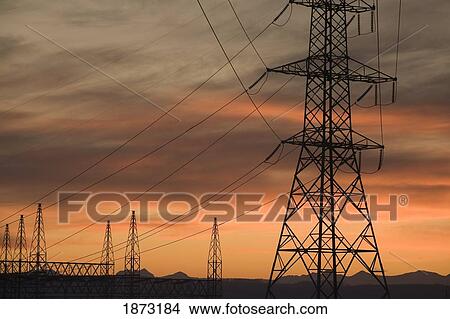 Picture - calgary, alberta, canada; electricity towers and wires at sunset. Fotosearch