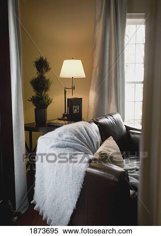 Stock Photography - couch in the corner of a living room. Fotosearch