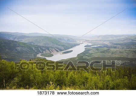 Stock Photo - dawson city, yukon territory, canada; yukon river from midnight dome. Fotosearch
