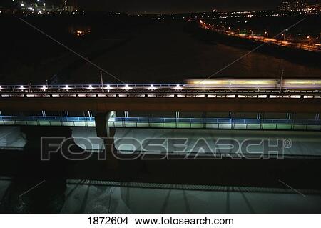 edmonton, alberta, canada; the high level bridge and the lrt bridge going over the north saskatchewan river at night View Large Photo Image Picture - edmonton, alberta, canada; the high level bridge and the lrt bridge going over the north saskatchewan river at night. Fotosearch