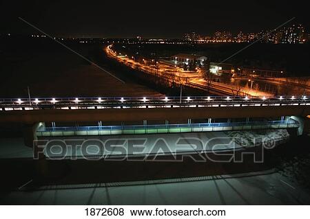 Stock Photo - edmonton, alberta, canada; the high level bridge and the lrt bridge going over the north saskatchewan river at night. Fotosearch