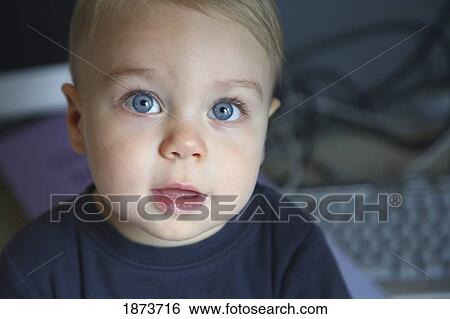 face of a young boy with big blue eyes View Large Photo Image Stock Photograph - face of a young boy with big blue eyes. Fotosearch