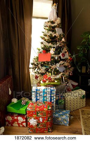 gifts around the christmas tree View Large Photo Image Stock Image - gifts around the christmas tree. Fotosearch