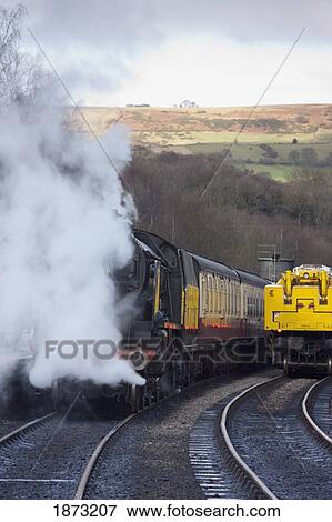 grosmont, north yorkshire, england; trains traveling on the tracks View Large Photo Image Stock Photo - grosmont, north yorkshire, england; trains traveling on the tracks. Fotosearch
