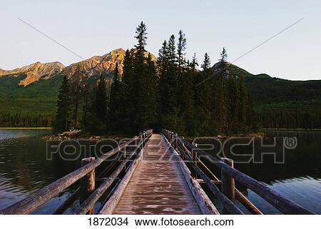 jasper national park, alberta, canada; a wooden boardwalk running across pyramid lake and pyramid mountain View Large Photo Image Picture - jasper national park, alberta, canada; a wooden boardwalk running across pyramid lake and pyramid mountain. Fotosearch