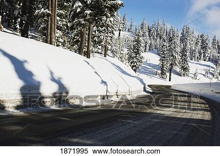 Stock Photography - oregon cascades, oregon, united states of america; a road and fresh winter snow on mount hood. Fotosearch