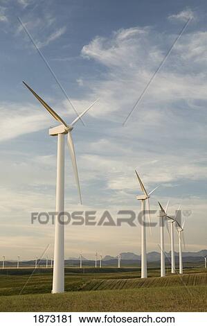 Stock Image - pincher creek, alberta, canada; wind turbines in a row. Fotosearch