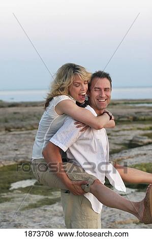 port colborne, ontario, canada; a couple enjoying time together on the beach View Large Photo Image Stock Photo - port colborne, ontario, canada; a couple enjoying time together on the beach. Fotosearch