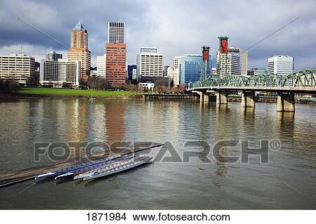 Picture - portland, oregon, united states of america; boats along a pier on willamette river and downtown portland. Fotosearch