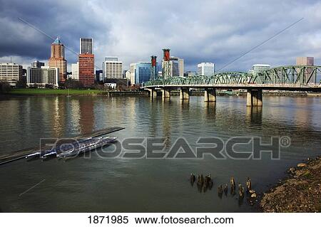 Stock Photography - portland, oregon, united states of america; boats along a pier on willamette river and downtown portland. Fotosearch