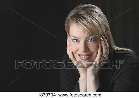 portrait of a woman holding her face in her hands View Large Photo Image Picture - portrait of a woman holding her face in her hands. Fotosearch