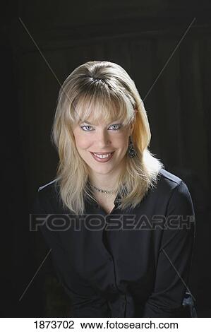 Stock Image - portrait of a woman wearing black. Fotosearch
