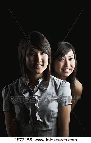 portrait of two young women View Large Photo Image Stock Photography - portrait of two young women. Fotosearch