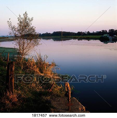 Stock Photo - River Bann at dusk at Bannfoot, Co Armagh, Ireland. Fotosearch