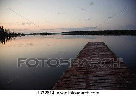saskatchewan, canada; a dock going out to anglin lake View Large Photo Image Picture - saskatchewan, canada; a dock going out to anglin lake. Fotosearch