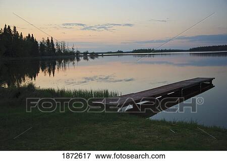 saskatchewan, canada; a dock going out to anglin lake View Large Photo Image Stock Photo - saskatchewan, canada; a dock going out to anglin lake. Fotosearch