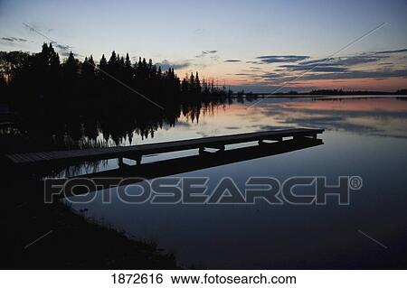 Stock Photograph - saskatchewan, canada; a dock going out to anglin lake. Fotosearch