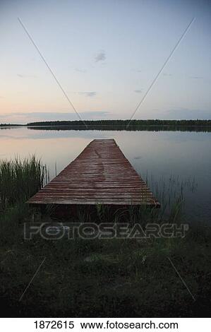 Stock Photography - saskatchewan, canada; a dock going out to anglin lake. Fotosearch
