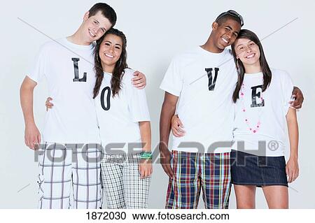teenage couples with their t-shirts spelling 'love' View Large Photo Image Stock Image - teenage couples with their t-shirts spelling 'love'. Fotosearch