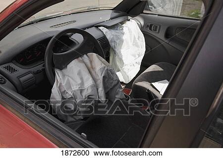 two air bags deflated in the front seat of a car View Large Photo Image Stock Image - two air bags deflated in the front seat of a car. Fotosearch