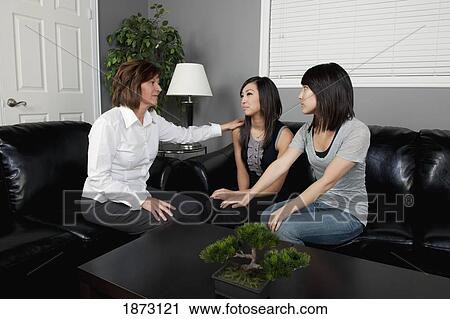 Stock Image - women showing support for another woman. Fotosearch