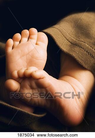 Picture - a baby's bare feet. Fotosearch