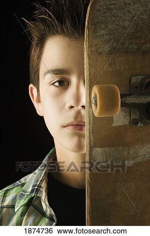 a boy with a skateboard View Large Photo Image Stock Photograph - a boy with a skateboard. Fotosearch