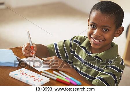 a boy writing thank you cards View Large Photo Image Stock Image - a boy writing thank you cards. Fotosearch