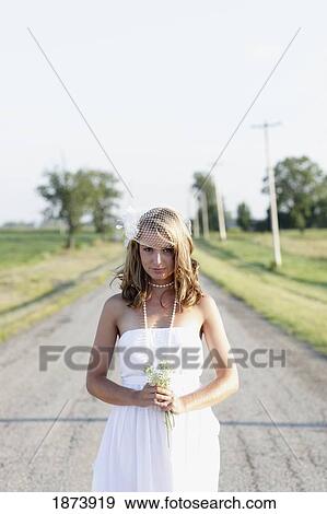 a bride standing in the middle of the road View Large Photo Image Stock Photo - a bride standing in the middle of the road. Fotosearch