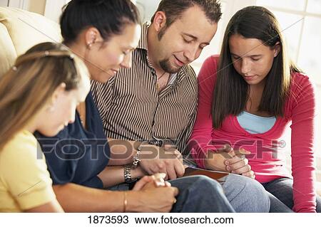 a family praying together View Large Photo Image Stock Image - a family praying together. Fotosearch
