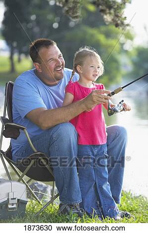 Stock Image - a father and daughter fishing. Fotosearch